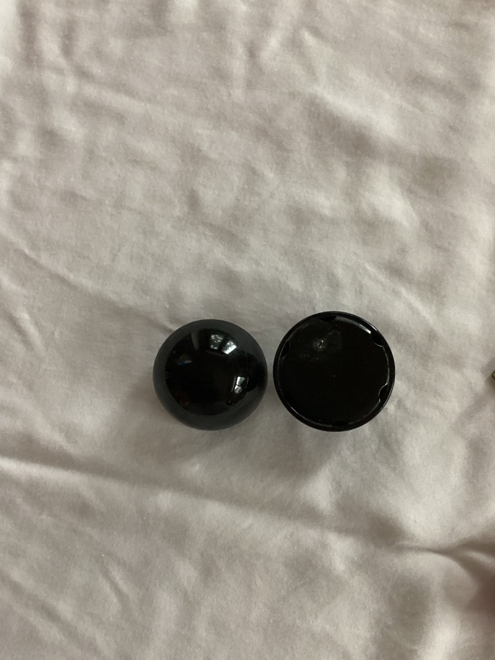 Women’s black circular earrings